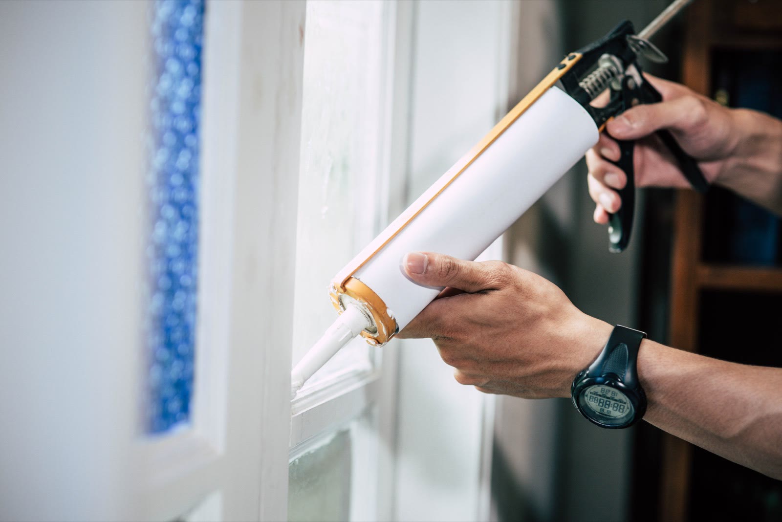 Installer sealing around a new window frame